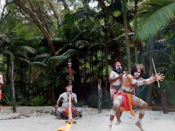 Group of Yugambeh Aboriginal warriors dance during Aboriginal culture show in Queensland, Australia.