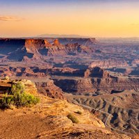 Canyonlands National Park is perfect for hiking, camping, and rock climbing because of its many trails and scenic views.