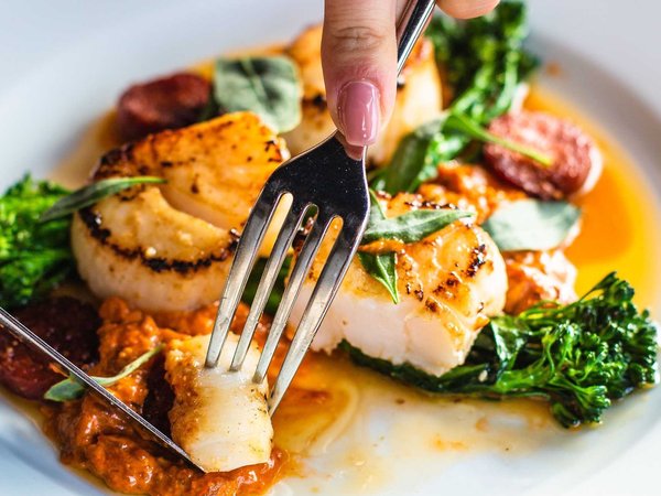 Moments before an culinary tourism influencer enjoys the first bite of an entree.