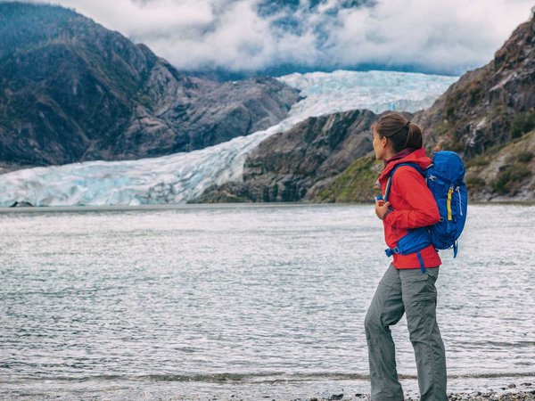 Alaska glacier tourist lifestyle in Juneau. Famous Mendenhall ice landscape summer travel destination. Cruise ship attraction.