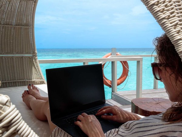 Jennifer uses quite time in the shade to catch up on work emails
