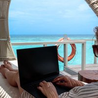 Jennifer uses quite time in the shade to catch up on work emails