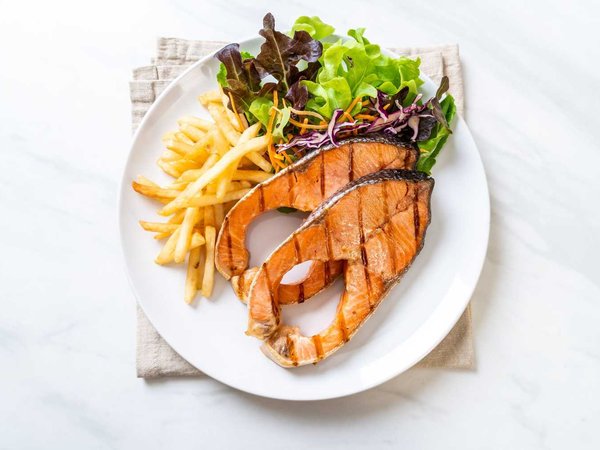 grilled salmon steak fillet with french fries
