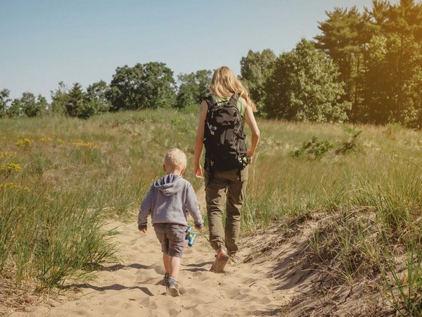 Mother and young son walking along a path at Indiana Dunes State