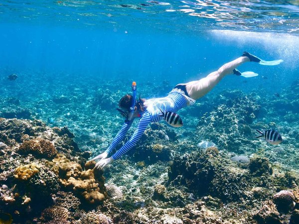 Woman with mask snorkeling