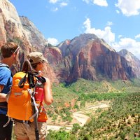 A couple of responsible tourists admire the view over Zion National Park