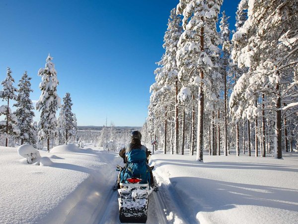 Traveling Lapland with snowmobile