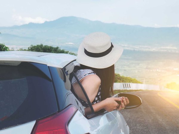 Looking out the window with a wanderlust for the next travel adventure