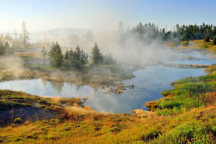 steaming geysers in West Thumb area in Yellowstone National Park, Wyoming