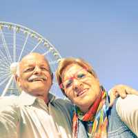 Happy retired senior couple taking selfie at travel around the w