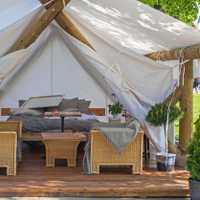 A fully decorated and furnished glamping tent