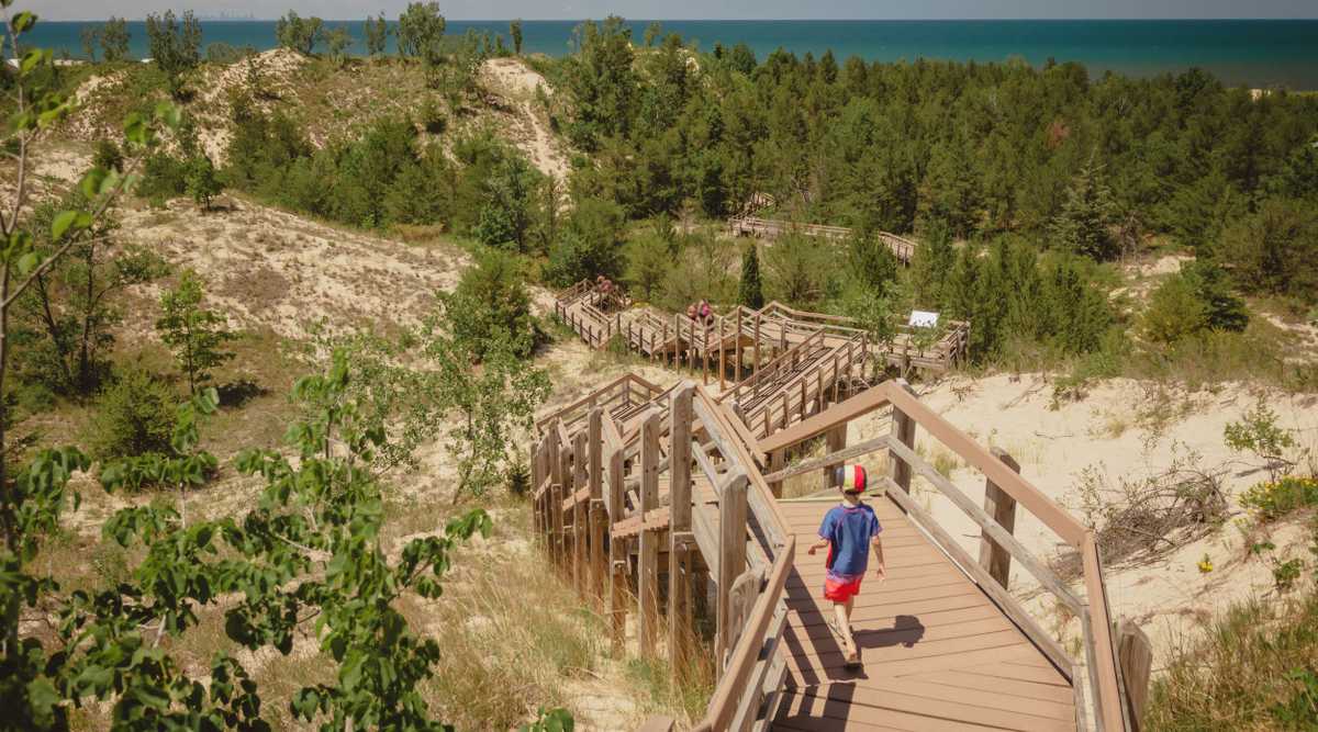 Boy hiking along dune succession trail in Indiana Dunes National