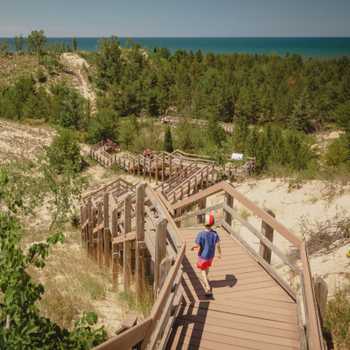 Boy hiking along dune succession trail in Indiana Dunes National