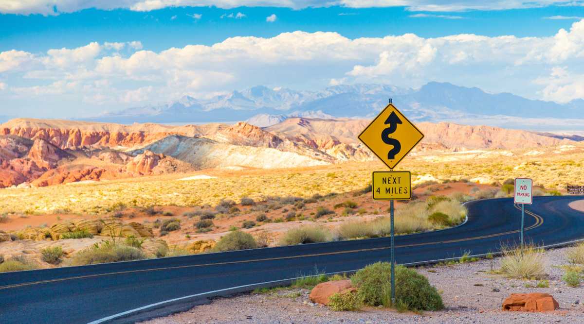 Winding road with signs in Valley of Fire State Park, Nevada
