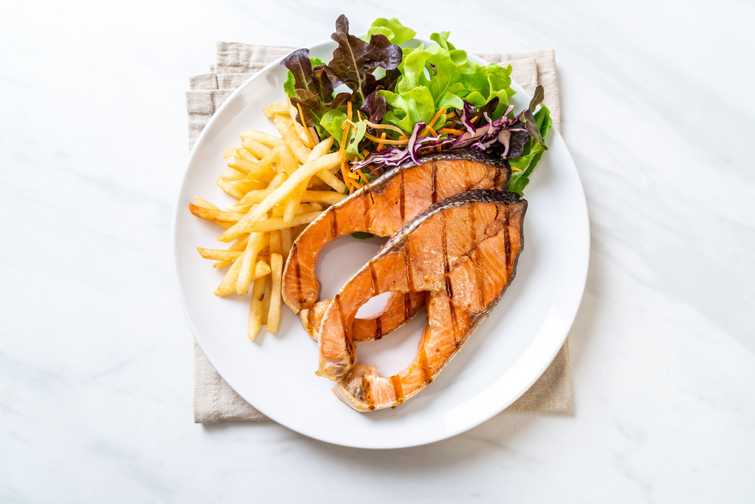 grilled salmon steak fillet with french fries