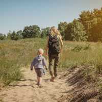 Mother and young son walking along a path at Indiana Dunes State